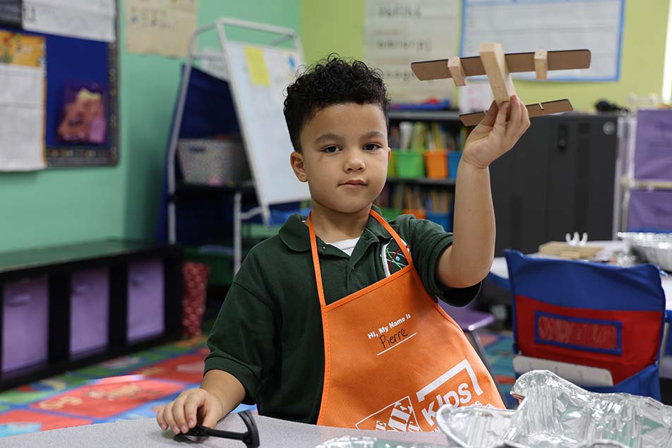 students and teacher working in classroom