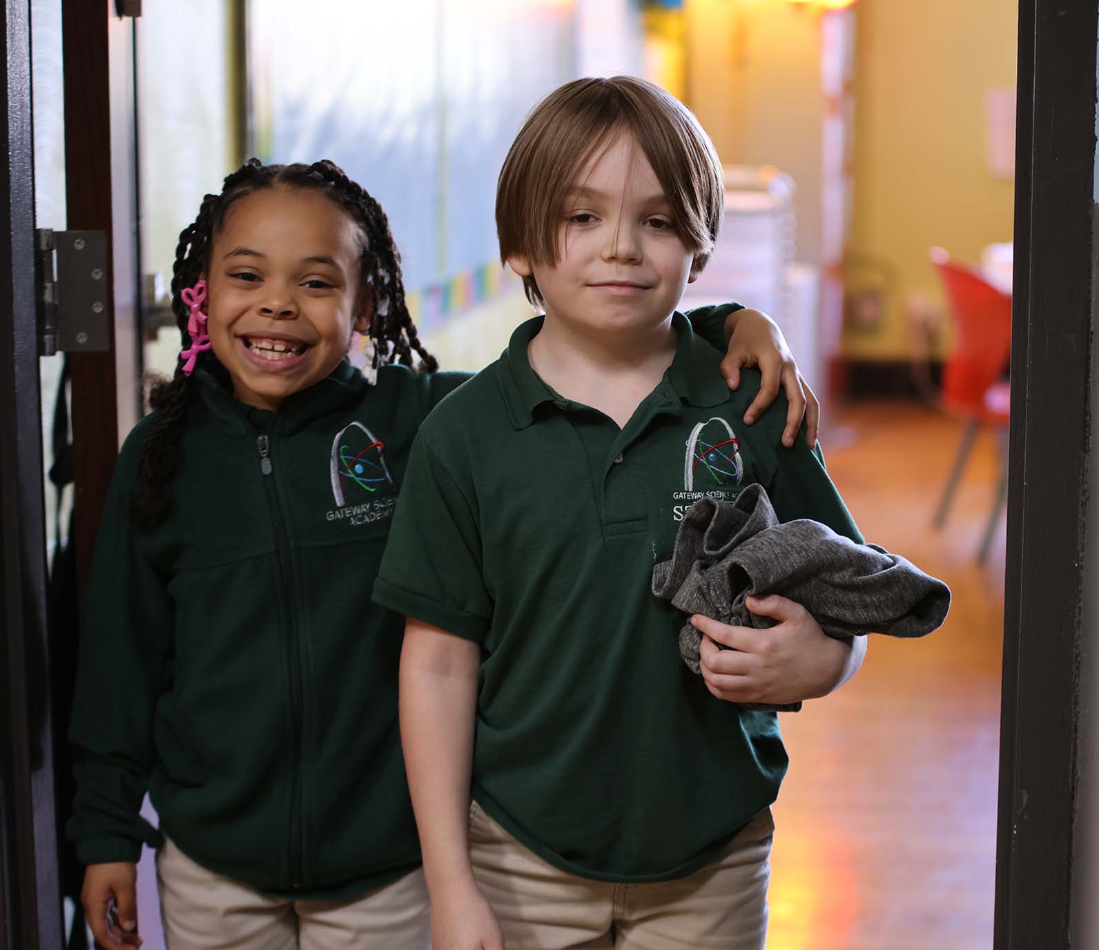 GSA St. Louis South student wearing headphones uses a laptop in class